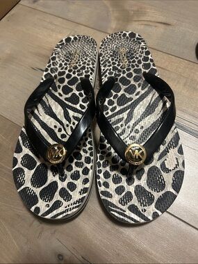 Michael Kors Black & White Animal Print Flip Flops with Gold MK Medallions